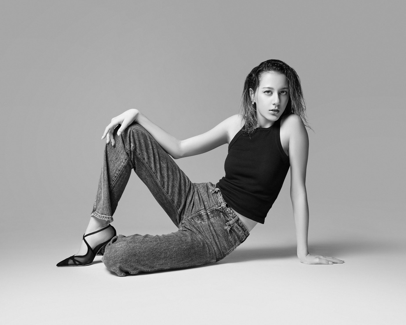 Editorial, black and white, seated on the floor